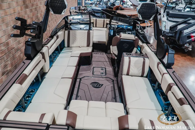 Slide: The Image of 2027 Malibu Wakesetter 25 LSV interior with luxurious seating at Lake Norman Marina. - 12