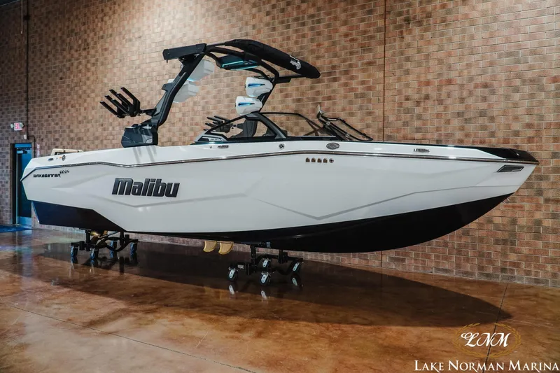Slide: The Image of 2027 Malibu Wakesetter 25 LSV boat displayed indoors at Lake Norman Marina. - 3