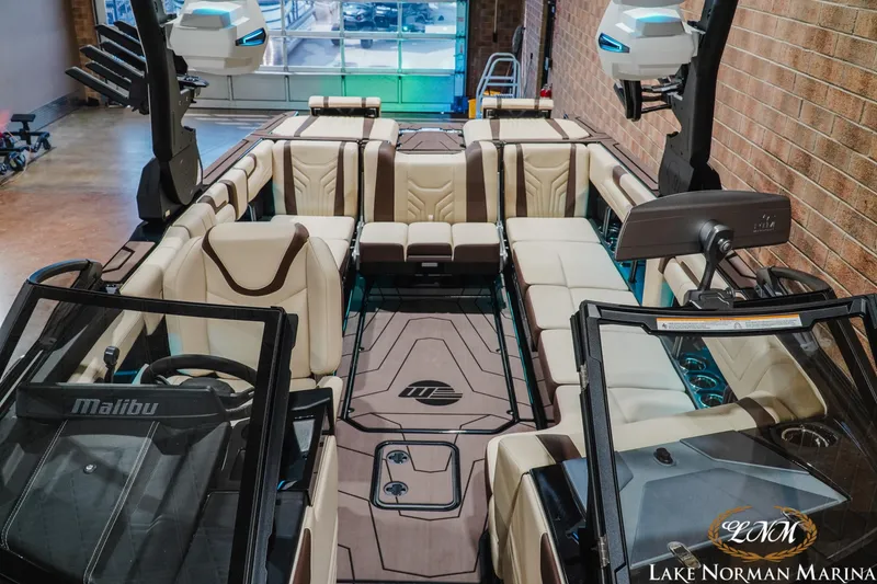 Slide: The Image of 2027 Malibu Wakesetter 25 LSV interior with luxurious seating and advanced features at Lake Norman Marina. - 24