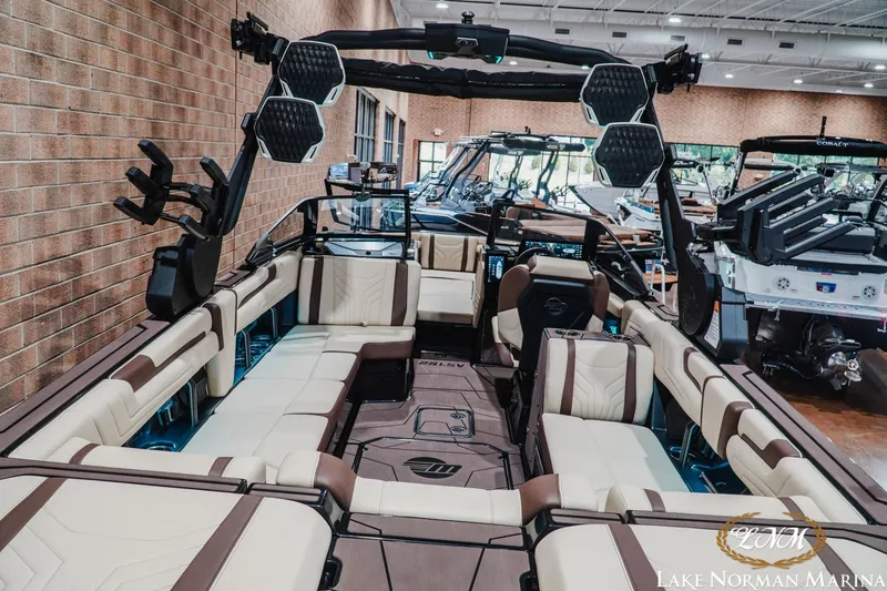 Slide: The Image of 2027 Malibu Wakesetter 25 LSV interior with luxurious seating at Lake Norman Marina. - 11