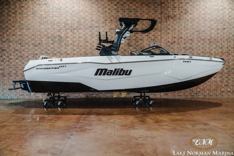 The Image of 2027 Malibu Wakesetter 25 LSV boat displayed indoors at Lake Norman Marina. - 1