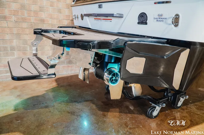 Slide: The Image of 2027 Malibu Wakesetter 25 LSV boat stern with advanced wakeboarding features at Lake Norman Marina. - 10