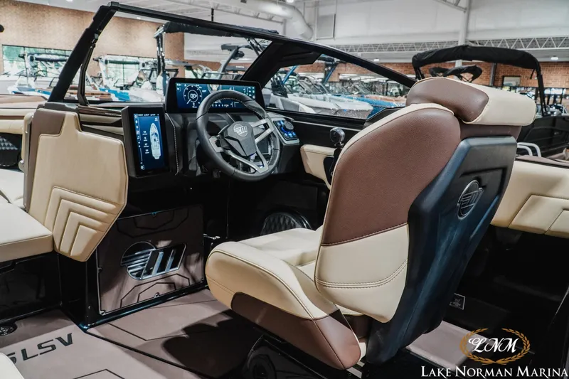 Slide: The Image of Interior of 2027 Malibu Wakesetter 25 LSV boat with modern dashboard and seating. - 20