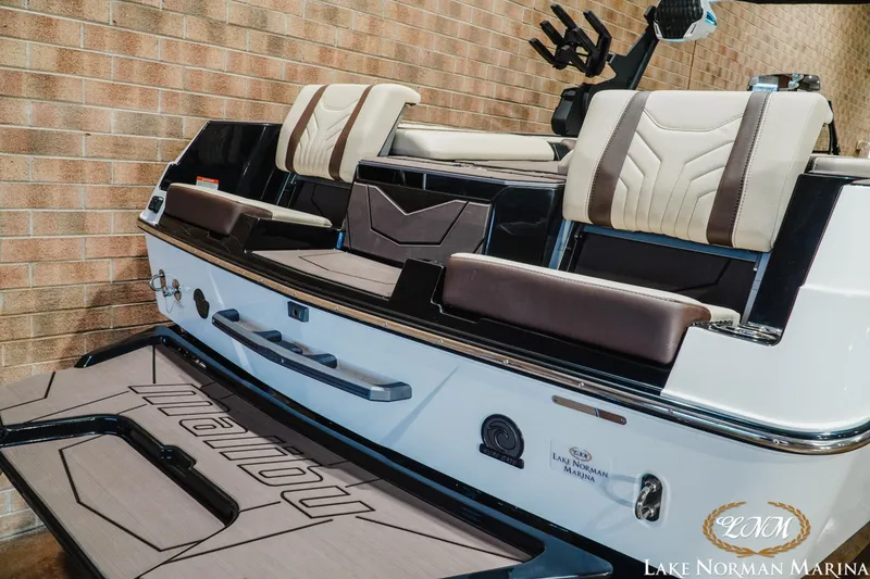 Slide: The Image of 2027 Malibu Wakesetter 25 LSV boat interior with luxurious seating at Lake Norman Marina. - 8