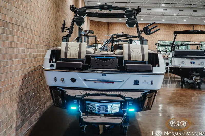Slide: The Image of 2027 Malibu Wakesetter 25 LSV boat displayed indoors at Lake Norman Marina. - 7