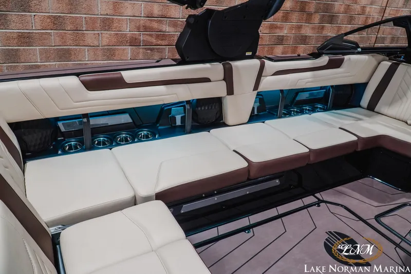 Slide: The Image of Luxurious interior of 2027 Malibu Wakesetter 25 LSV with plush seating and ambient lighting. - 17