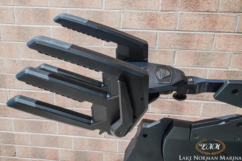 Slide: The Image of 2027 Malibu Wakesetter 25 LSV wakeboard rack against brick wall at Lake Norman Marina. - 31