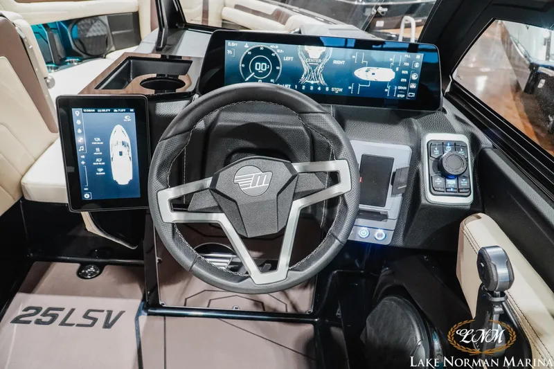 Slide: The Image of 2027 Malibu Wakesetter 25 LSV dashboard with advanced digital controls and steering wheel. - 22