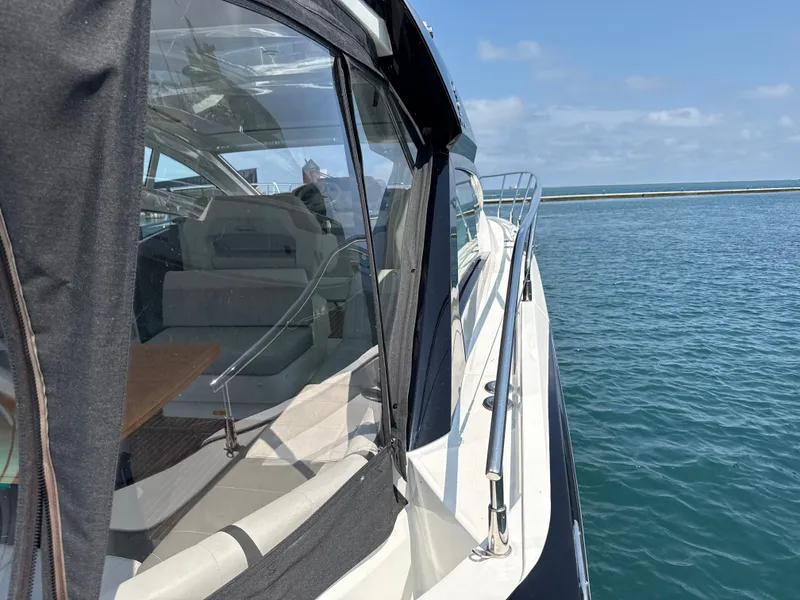 Slide: The Image of The 2020 Beneteau Gran Turismo 40 is on the water, featuring a sleek design and spacious cockpit. - 25