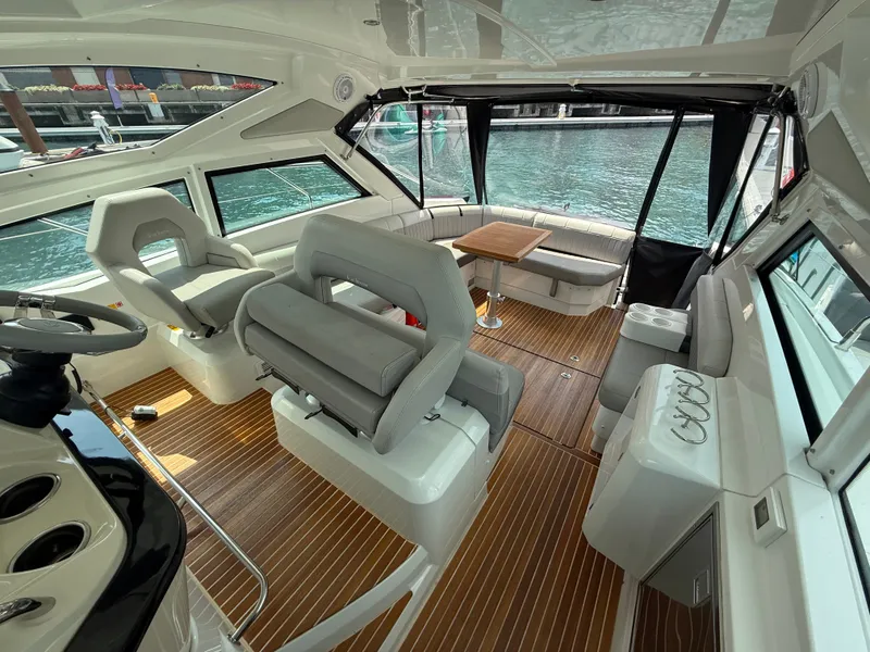 Slide: The Image of The image shows the interior of a 2020 Beneteau Gran Turismo 40 with sleek seating and wood flooring. - 8