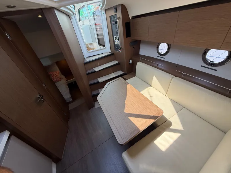 Slide: The Image of Interior of a 2020 Beneteau Gran Turismo 40 with light upholstery and wooden furnishings. - 41