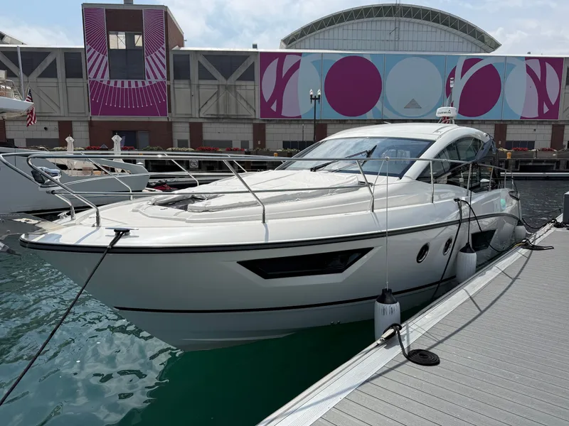 Slide: The Image of 2020 Beneteau Gran Turismo 40 docked, featuring sleek design with modern lines and large windows. - 3