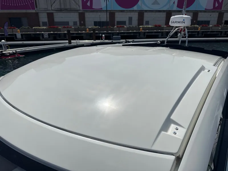Slide: The Image of The image shows the roof of a 2020 Beneteau Gran Turismo 40 at a dock. - 30