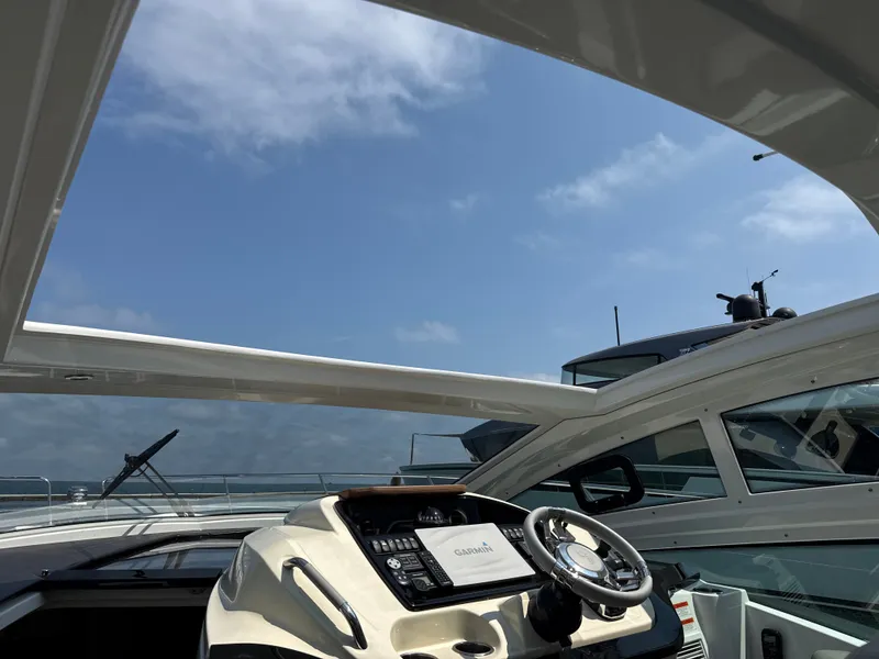 Slide: The Image of The image shows the cockpit of a 2020 Beneteau Gran Turismo 40 with a modern helm station. - 23