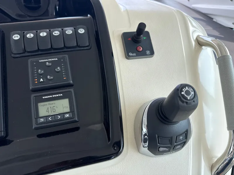 Slide: The Image of Close-up of a Beneteau Gran Turismo 40 helm with joystick and controls. - 20