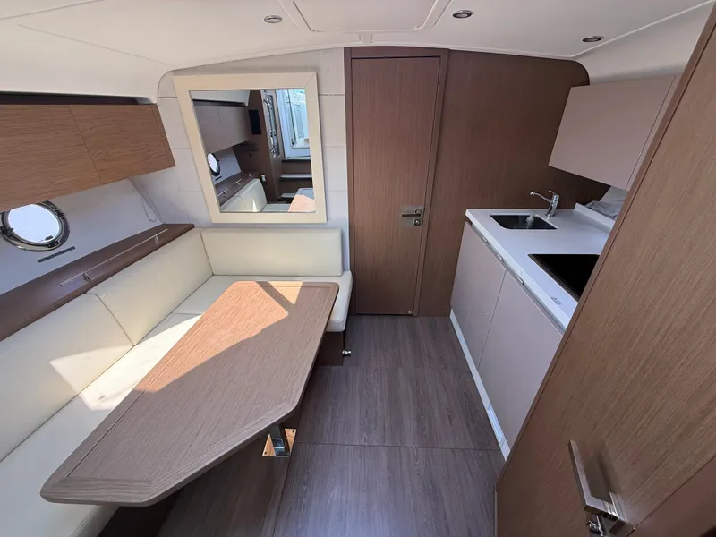 Slide: The Image of Interior of the 2020 Beneteau Gran Turismo 40 with modern kitchen and seating area. - 40