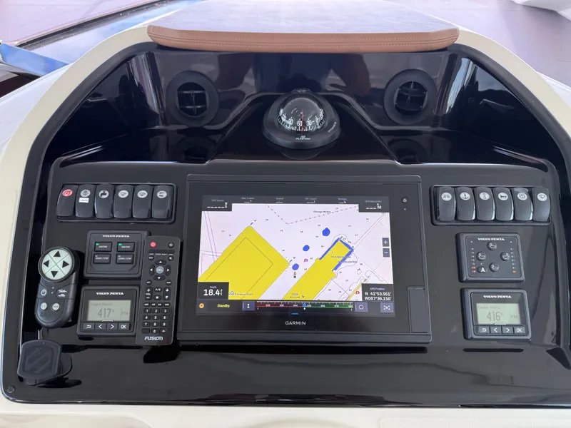 Slide: The Image of The image shows the dashboard of a 2020 Beneteau Gran Turismo 40 with a Garmin navigation system. - 19