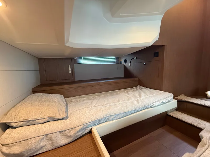 Slide: The Image of The cabin of the 2020 Beneteau Gran Turismo 40 features elegant, modern design with wood accents. - 34
