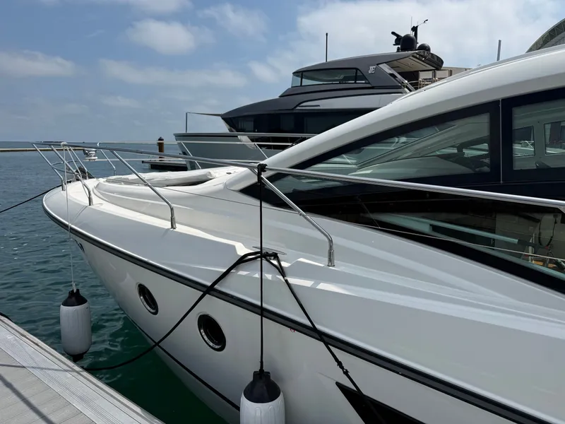 Slide: The Image of The 2020 Beneteau Gran Turismo 40 is docked. It features a sleek, modern design. - 4