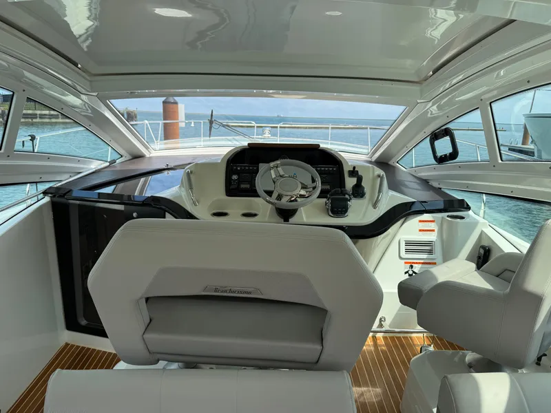 Slide: The Image of The cockpit of the 2020 Beneteau Gran Turismo 40 features modern controls and comfortable seating. - 14