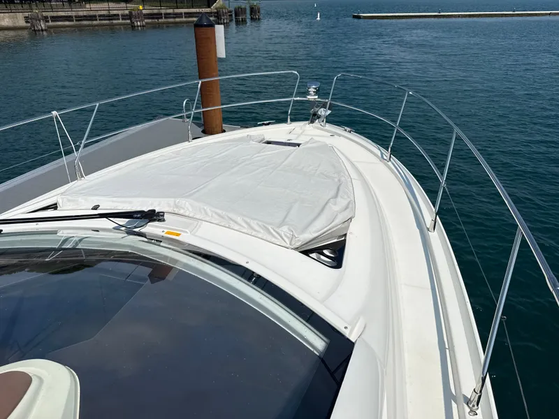 Slide: The Image of The image shows the deck of a 2020 Beneteau Gran Turismo 40 in a harbor. - 27