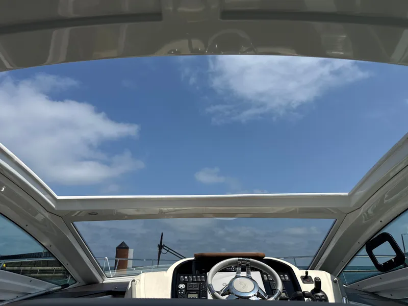 Slide: The Image of The image shows the cockpit of a 2020 Beneteau Gran Turismo 40 with an open roof. - 22