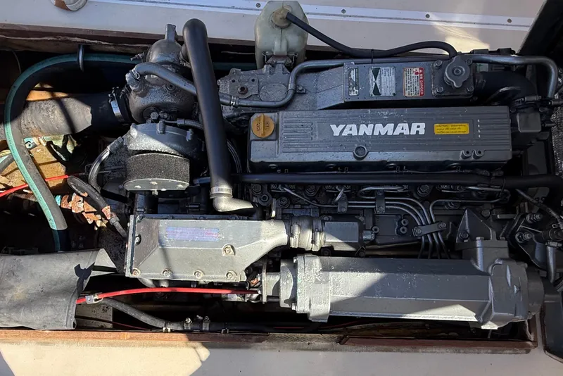 Slide: The Image of Engine of a 1978 Wasque 26 boat featuring a Yanmar diesel engine. - 25