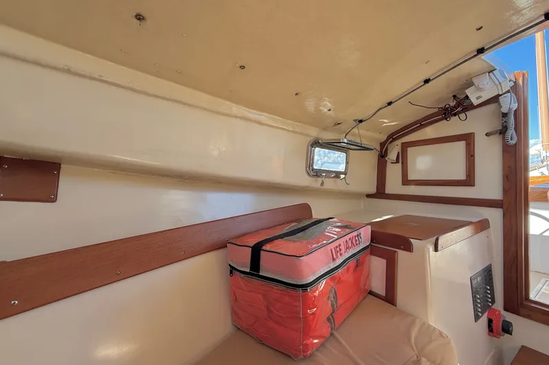Slide: The Image of Interior of a 1978 Wasque 26 boat with life jacket storage. - 15