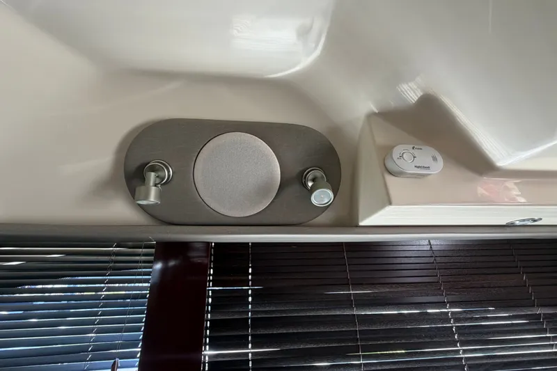 Slide: The Image of Interior of 2010 Sea Ray 390 Sedan Bridge with speaker and control panel. - 93