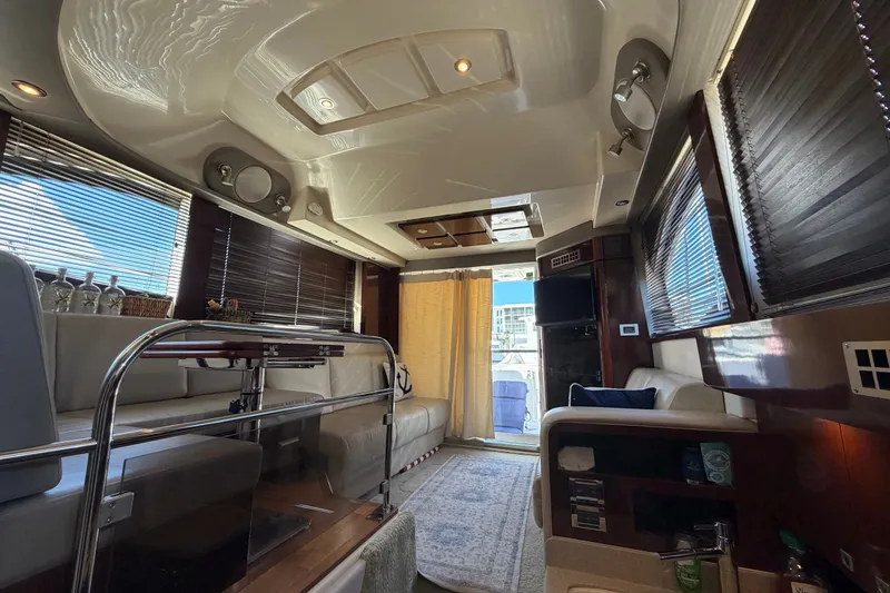 Slide: The Image of Luxurious interior of 2010 Sea Ray 390 Sedan Bridge yacht with elegant seating and modern amenities. - 51