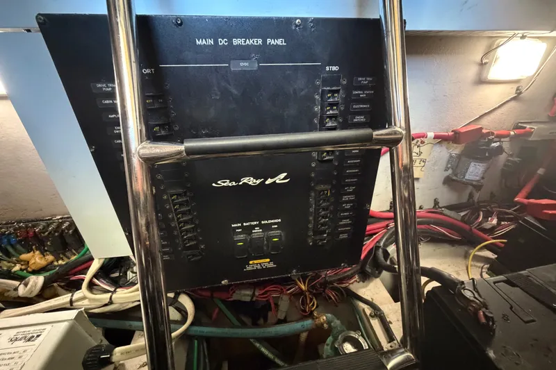 Slide: The Image of Main DC breaker panel on 2010 Sea Ray 390 Sedan Bridge yacht, with wiring and controls. - 139