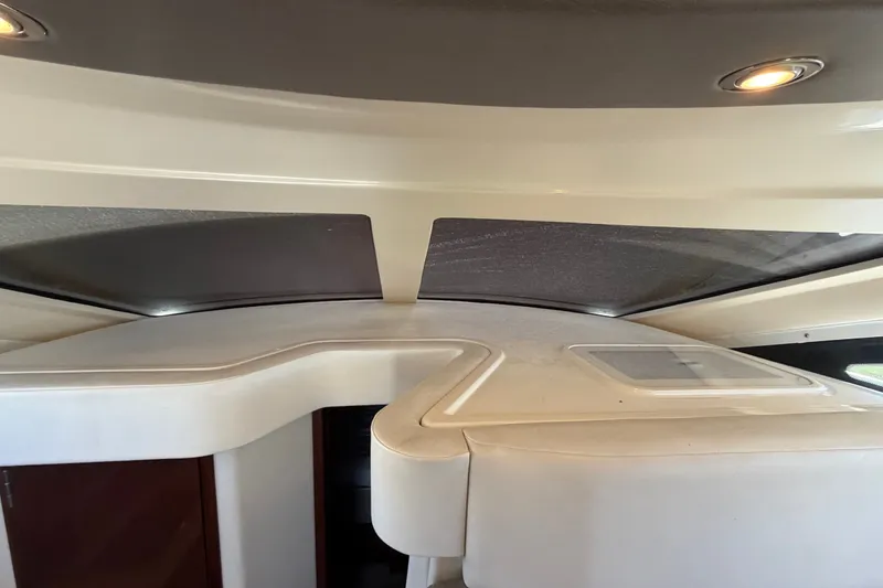 Slide: The Image of Interior view of 2010 Sea Ray 390 Sedan Bridge with modern ceiling design. - 96