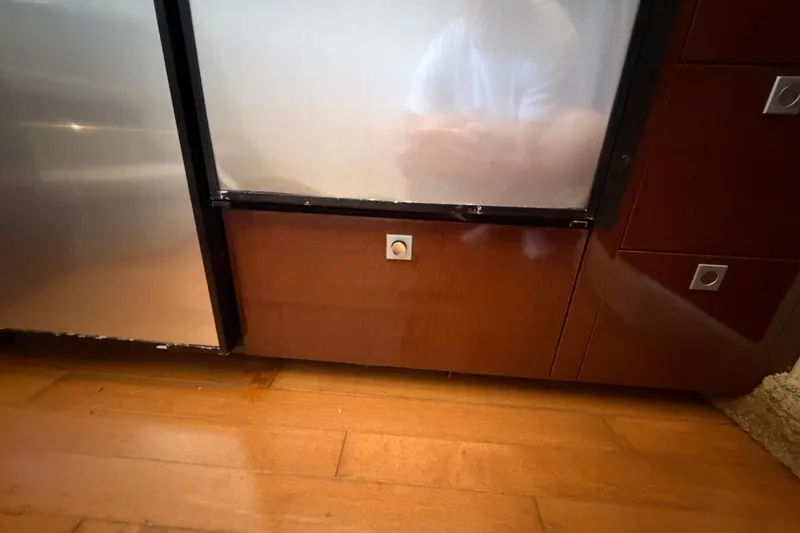 Slide: The Image of Wooden cabinetry and stainless steel appliance on Sea Ray 390 Sedan Bridge, 2010 model. - 66
