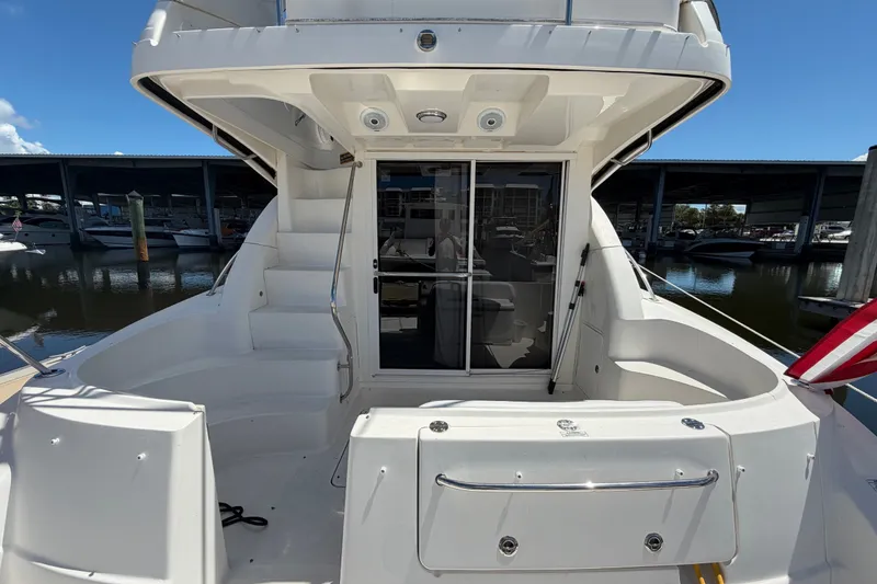 Slide: The Image of 2010 Sea Ray 390 Sedan Bridge yacht, rear view with stairs and sliding door. - 12