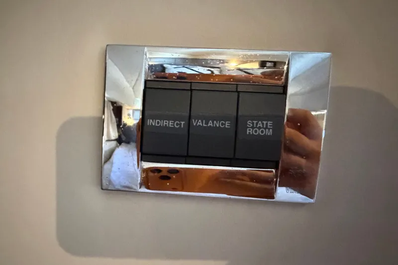 Slide: The Image of Light switch panel on 2010 Sea Ray 390 Sedan Bridge yacht interior. - 108