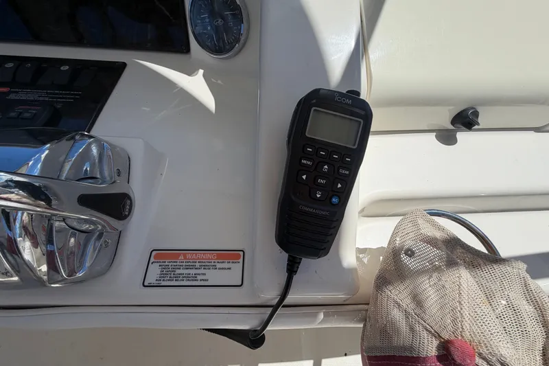 Slide: The Image of Control panel of 2010 Sea Ray 390 Sedan Bridge with Icom marine radio. - 43