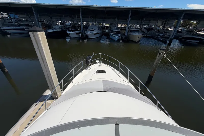 Slide: The Image of Bow view of 2010 Sea Ray 390 Sedan Bridge docked at marina. - 5