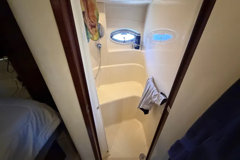Slide: The Image of Shower area in 2010 Sea Ray 390 Sedan Bridge yacht with porthole windows. - 114