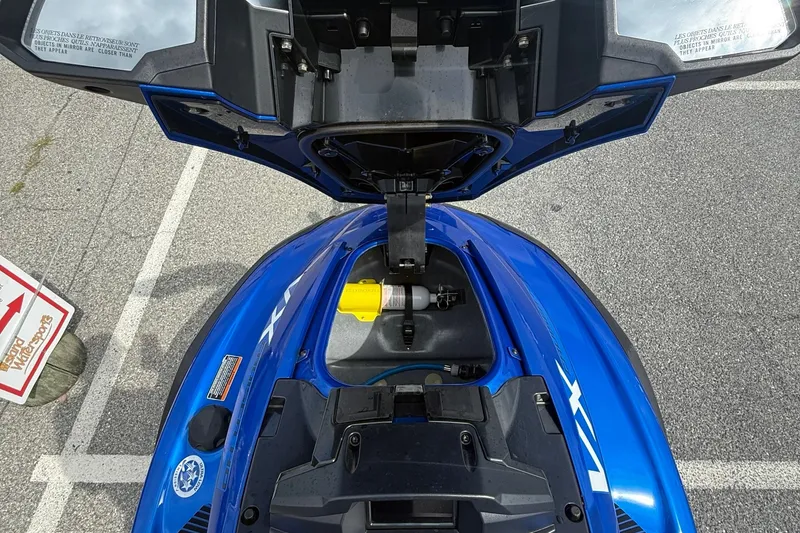 Slide: The Image of 2024 Yamaha WaveRunner FX Cruiser HO, blue, open storage compartment view. - 14