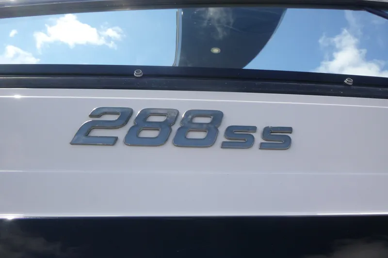 Slide: The Image of 2014 Monterey 288SS Super Sport boat emblem against blue sky. - 22