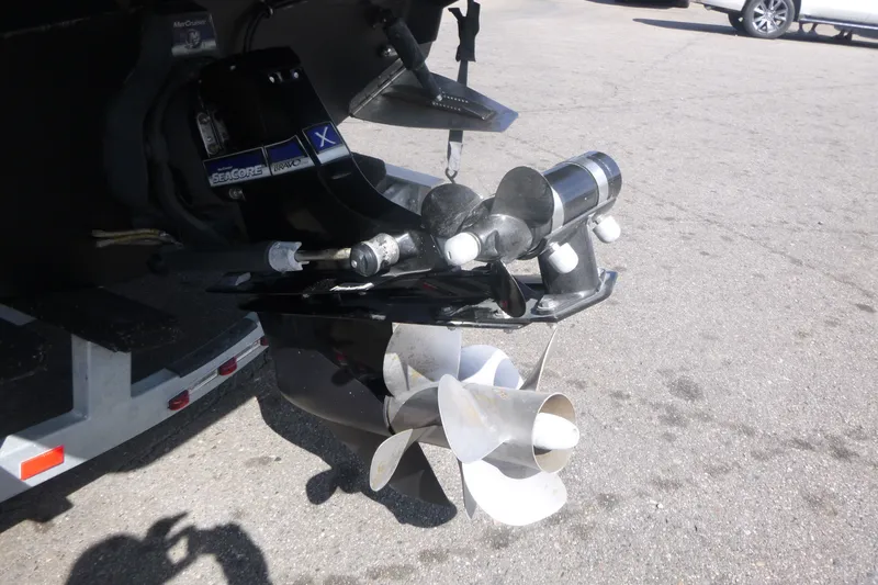 Slide: The Image of 2014 Monterey 288SS Super Sport boat propeller and drive system on pavement. - 20