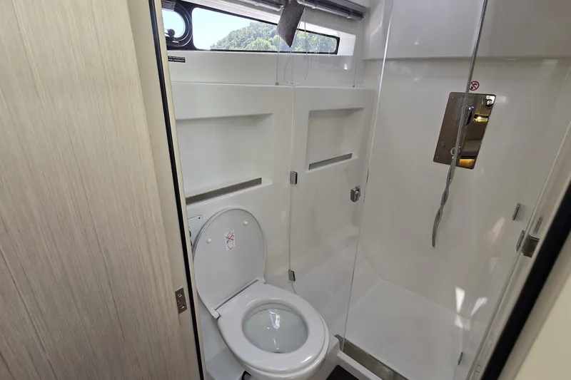 Slide: The Image of Modern bathroom in 2025 Four Winns TH36 yacht with toilet and shower. - 23