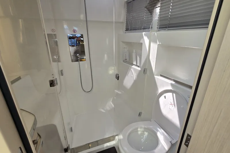 Slide: The Image of Modern bathroom in 2025 Four Winns TH36 yacht with shower and toilet. - 21