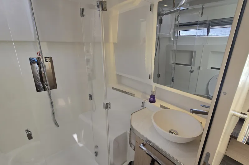 Slide: The Image of Modern bathroom in 2025 Four Winns TH36 yacht with sleek fixtures and glass shower. - 19