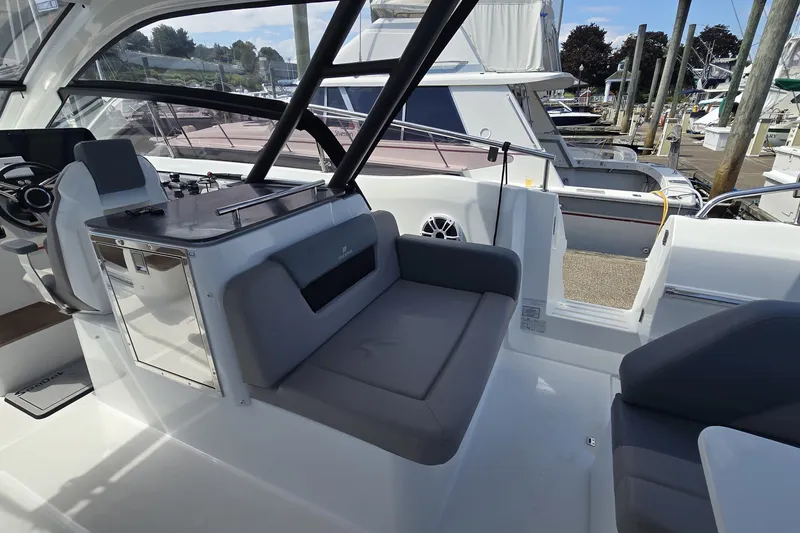 Slide: The Image of Interior view of 2025 Four Winns TH36 boat, featuring sleek seating and modern design. - 7