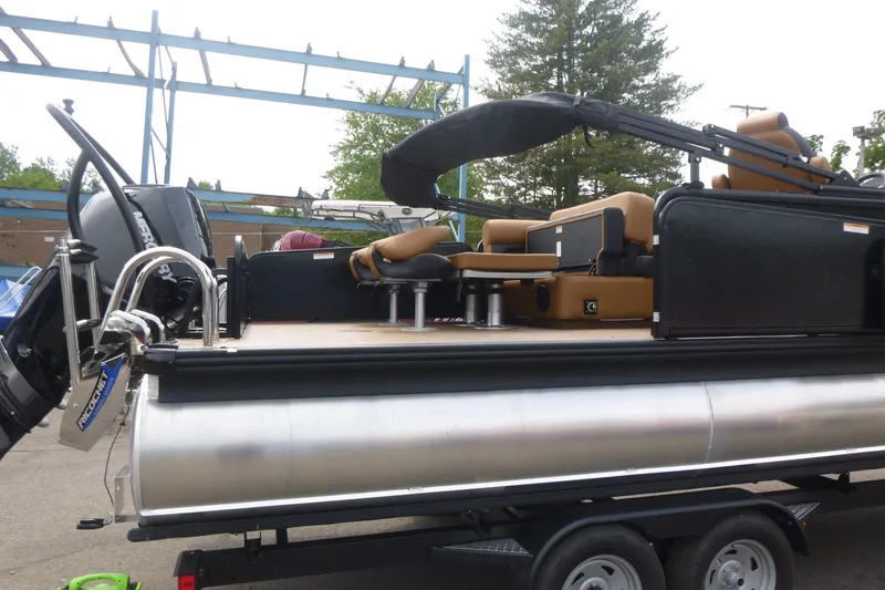 Slide: The Image of 2027 Premier 230 Sunsation RS - CL pontoon boat with tan seating and outboard motor. - 5