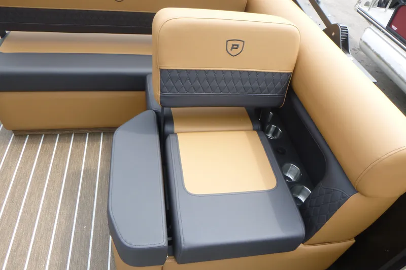 Slide: The Image of Luxurious seating on 2027 Premier 230 Sunsation RS - CL boat, featuring tan and gray upholstery. - 12