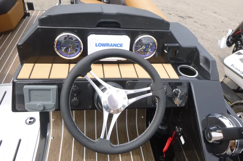 Slide: The Image of Steering console of 2027 Premier 230 Sunsation RS - CL with Lowrance display. - 15