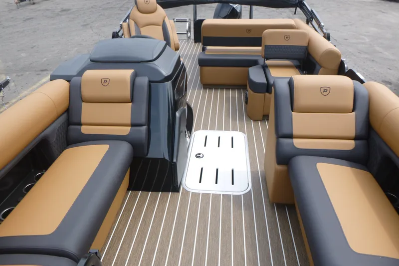 Slide: The Image of Luxurious interior of 2027 Premier 230 Sunsation RS - CL pontoon boat with tan and gray seating. - 6