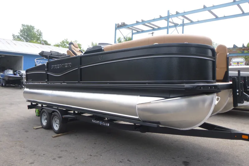 Slide: The Image of 2027 Premier 230 Sunsation RS - CL pontoon boat on trailer, outdoor setting. - 2